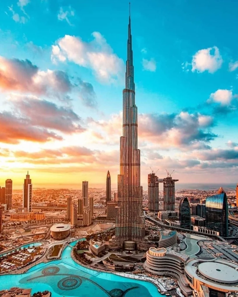 Dubai skyline with Burj Khalifa and Dubai Fountain at sunset